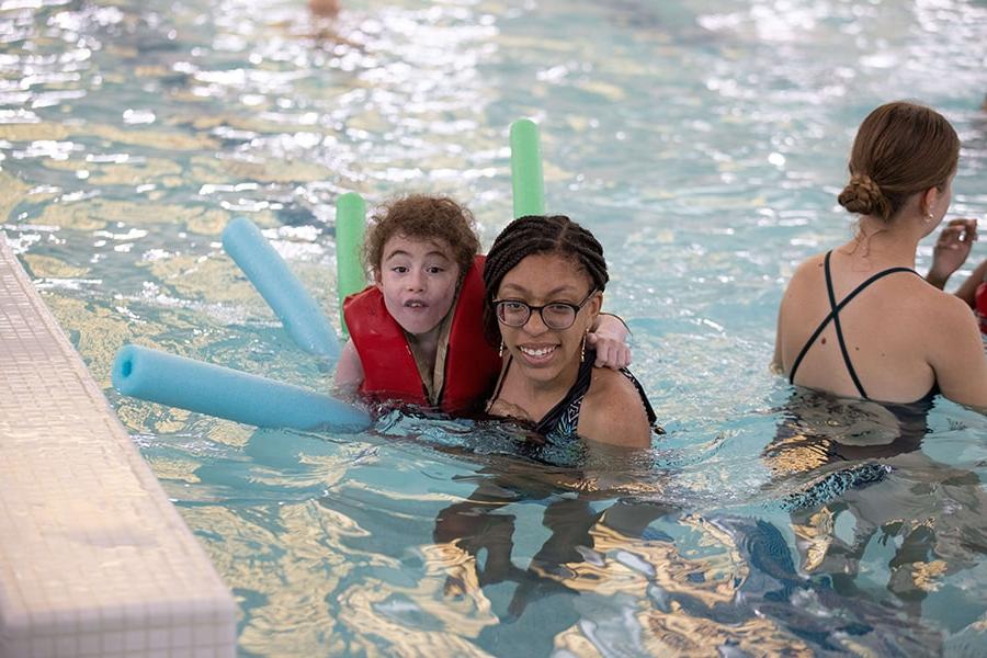 Camp Shriver kid and counselor in pool